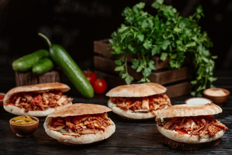 turkish-doner-served-inside-bread-buns-rustic-wooden-table (1)